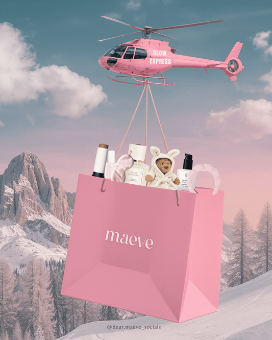 Pink helicopter labeled Glow Express carrying a pink gift bag with beauty products over snowy mountains